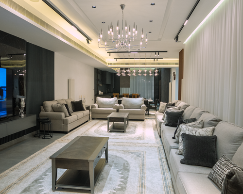 A modern living room with balanced natural and artificial lighting